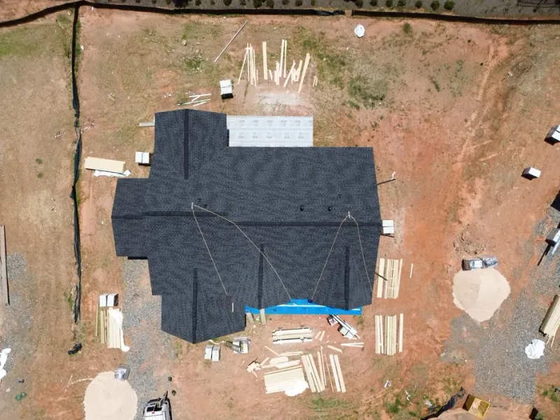 Best Cumming Roofer team performing a free roof inspection on a residential home in Cumming, GA