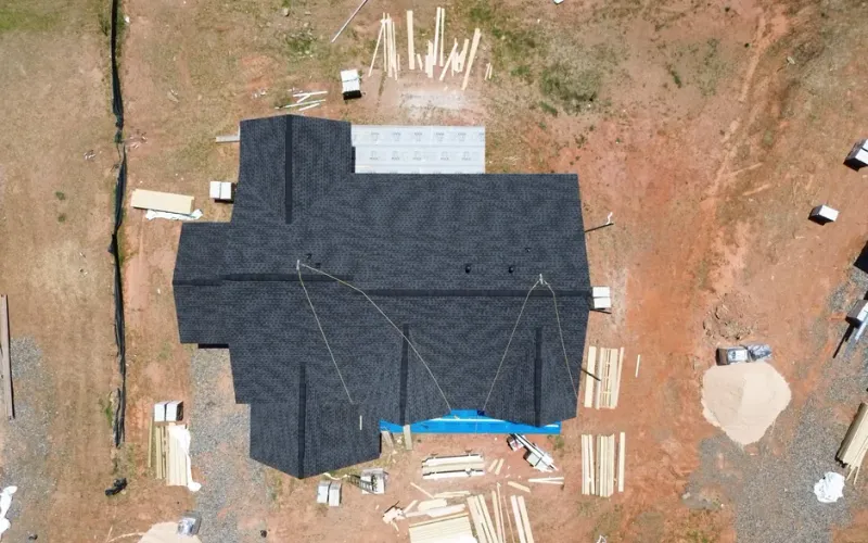 Best Cumming Roofer team performing a free roof inspection on a residential home in Cumming, GA