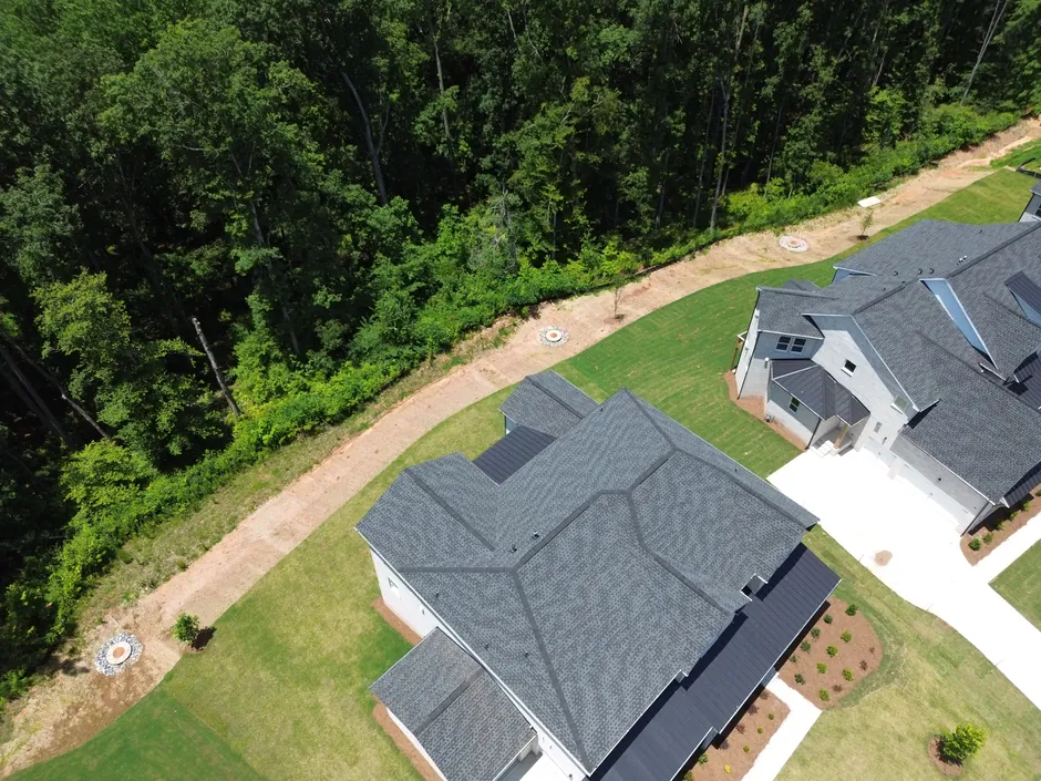 Standing behind our roof repair work